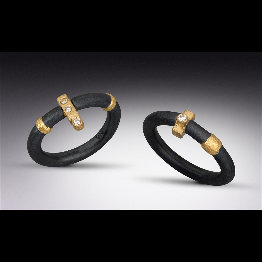 Two Rings Oxidized sterling silver, 22k gold, 14k gold, diamonds. Hand forged.
